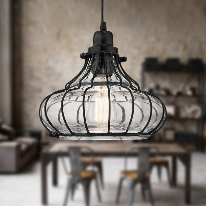 10" Aisling Black Metal Conical pendant light hanging above a dining table with a blurred background
