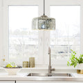 10 in. Nickel 1-Light Pendant with Painted Silver Glass Shade in a modern kitchen with sink and decorative items.