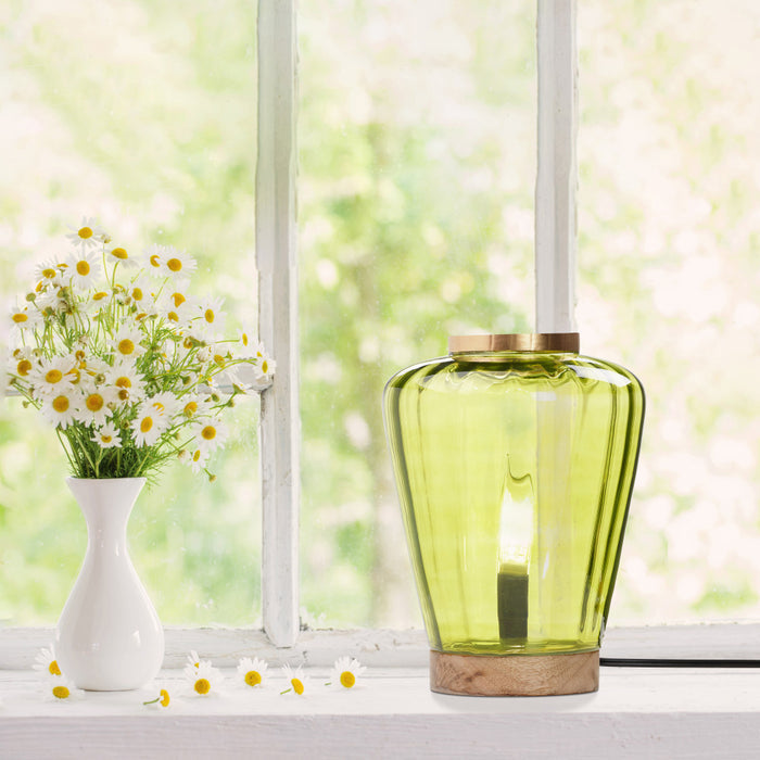 10.5" H Lila Chartreuse Green Glass Shade with a Mango Wood Block Base Accent Lamp and white vase with flowers on a windowsill