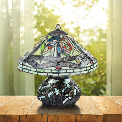 10.5"H Tiffany Style Dragonfly Accent Lamp on a wooden surface in front of window