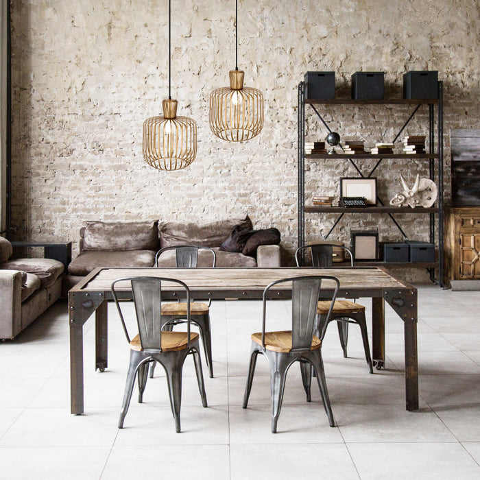 11.75"W Riley Caged Globe Shade Pendant Lighting in a dining area with wooden table, metal chairs, and a brick wall background.
