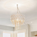 12.5"H Jeweled Blossoms Hanging Lamp hanging from the ceiling in a room with light-colored walls and a window.