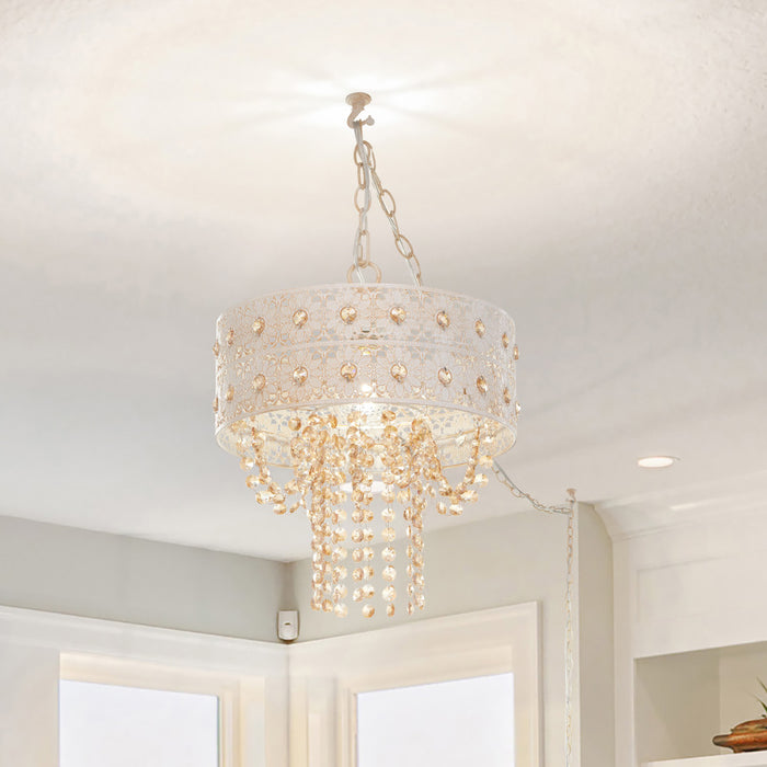 12.5"H Jeweled Blossoms Hanging Lamp hanging from the ceiling in a room with light-colored walls and a window.