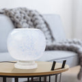 13" H Nautical White/Blue Globe Shade Stacked Base Accent Lamp on a wooden table with a blurred sofa in the background