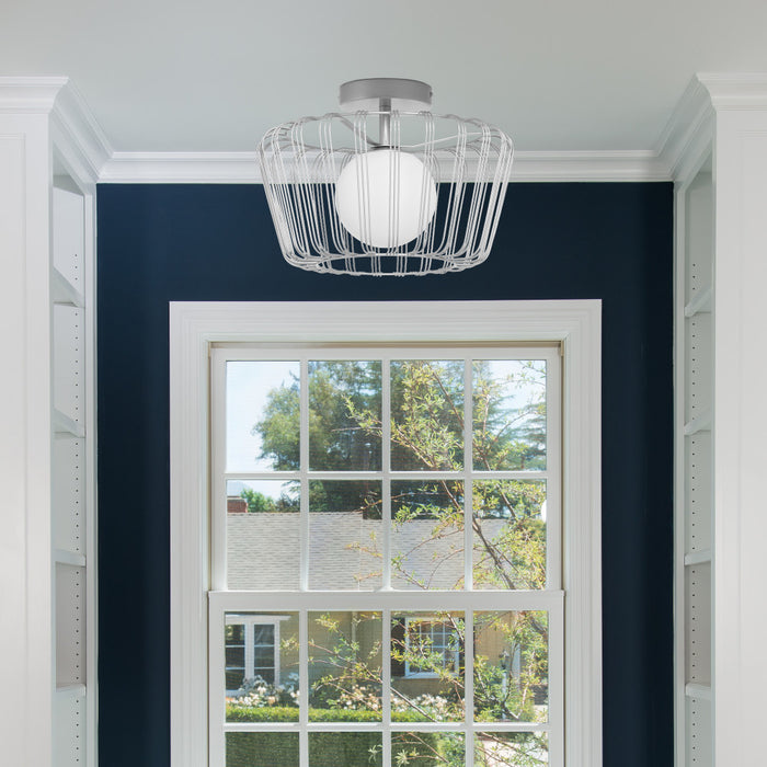 13"W Lucai Silver Caged Globe Shade Ceiling Light in a room with a window and blue wall