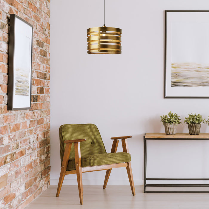 14" W Bruce Gold-Tone Metal Pendant in a modern interior with a green chair, wooden table, and decorative elements.