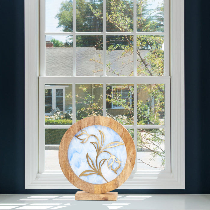 14" W Floral Theme Round Decorative Stained Glass & Metal Stand with Wood Frame in front of a window