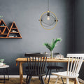 14.625"L Industrial Metal Pendant Light with Gold Accent in a dining room with wooden table, chairs, and decorative elements against a gray wall.