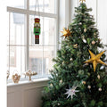 14"H Hans the Holiday Nutcracker Stained Glass Window Panel in a holiday setting
