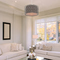 14"W Karla Silver Metal Pendant Light with Fabric Shade in a living room with beige sofas, decorative pillows, and a large window.