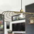 15.75" W Jessica Industrial Brass Woven Disk Shade Pendant in a blurred room setting