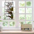 16" H Calla Lilies Design Stained Glass Window Panel hanging on a window in a bright room with a vintage radio on the windowsill.