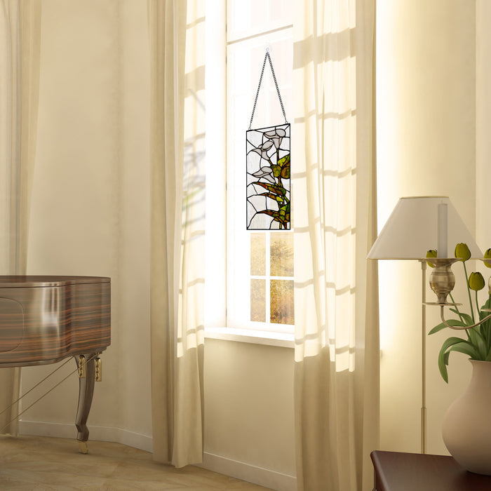 16" H Calla Lilies Design Stained Glass Window Panel suspended in a bright room with sheer curtains, a piano, and a floor lamp.