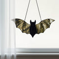 16" W Tiffany-Style Halloween Black Bat Stained Glass Window Panel hanging in a white framed window and shear drapes