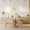 16.25" W 1-Light Josie Wood and Jute Dome Pendant in a modern kitchen with wooden table and chairs and light-colored cabinets