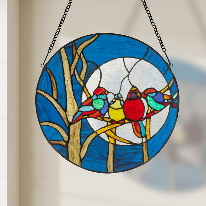 16"H Birds in the Night Sky Round Stained Glass Window Panel hanging in a blurred background