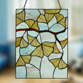 17.5"H Ginkgo Leaf Stained Glass Window Panel on a blurred background