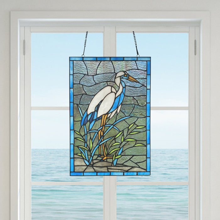 18-Inch Majestic Crane Stained Glass Window Panel in a window with water in the background