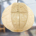 19" W Estelle Bohemian Ivory Jute Globe Shade Pendant against a blurred background