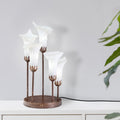 19.5" H Calla Lily Bronze Base with White Glass Bell Shades Candlestick Table Lamp on a white sideboard
