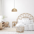 19.5" W 1-Light Arie Metal and Jute Pendant in a neatly arranged bedroom with a bed, nightstands, and decorative items.