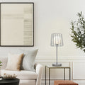19.75"H Lucai Caged Globe Shade Table Lamp Silver in a modern living room with a sofa, and decorative items.