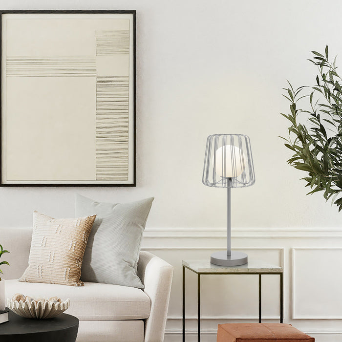 19.75"H Lucai Caged Globe Shade Table Lamp Silver in a modern living room with a sofa, and decorative items.