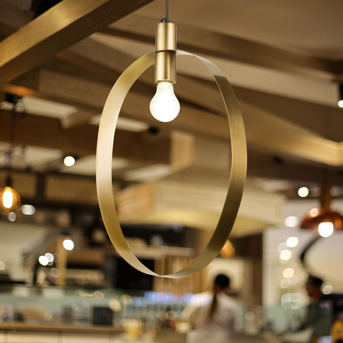 20" H Modern Brushed Gold Oval Shade Pendant in a blurred restaurant interior in the background