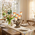 20"H Hand Blown Glass 5 Calla Lily Uplight Accent Lamp in an elegant dining room table setting with floral centerpiece