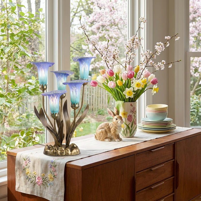 20"H Hand Blown Glass 5 Calla Lily Uplight Accent Lamp in a decorative table setting with a floral arrangement and rabbit figurine in a bright room.