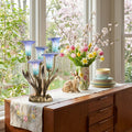20"H Hand Blown Glass 5 Calla Lily Uplight Accent Lamp in a decorative table setting with a floral arrangement and rabbit figurine in a bright room.