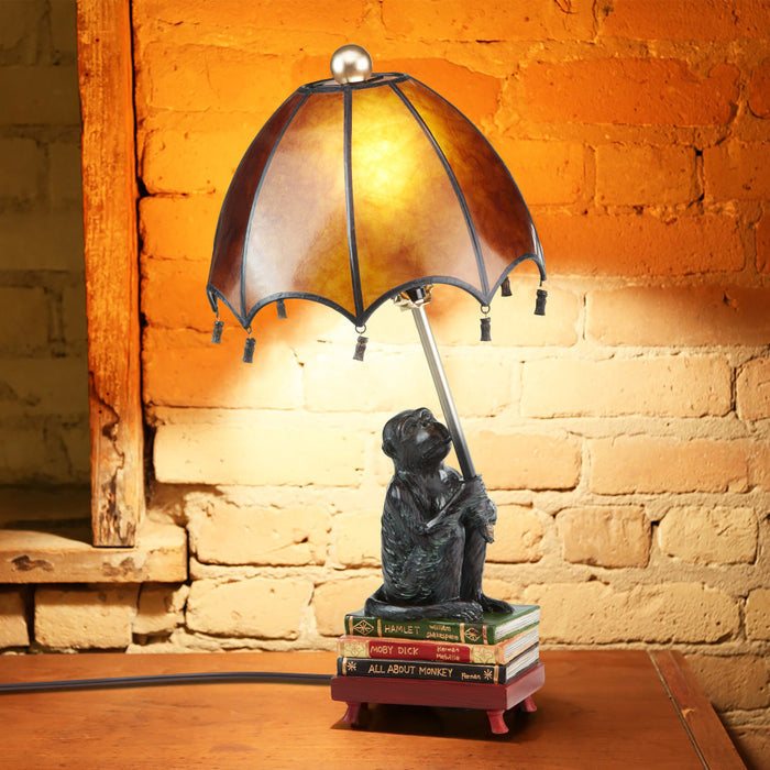 21.75"H Intellectual Monkey Table Lamp against a brick wall.
