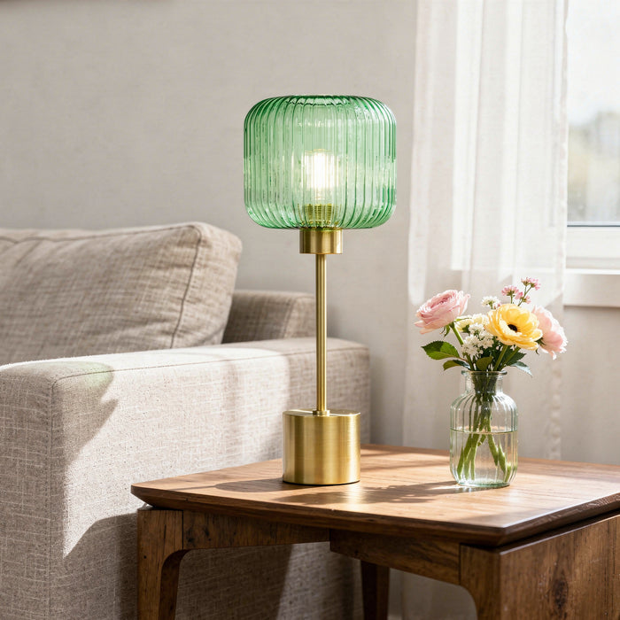 21"H Eagan Globe Shade Table Lamp on a wooden table with a vase of flowers in a living room setting.