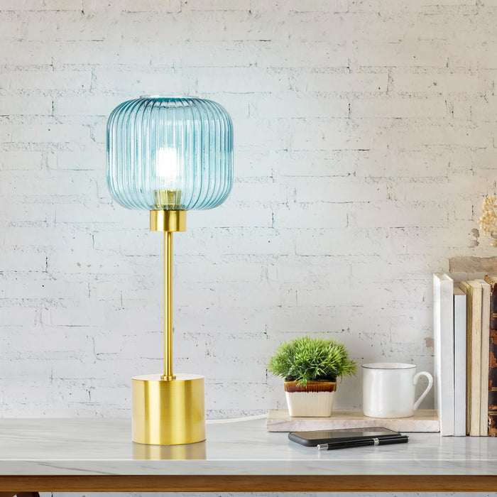 21"H Eagan Globe Shade Table Lamp on a desk against a white brick wall.