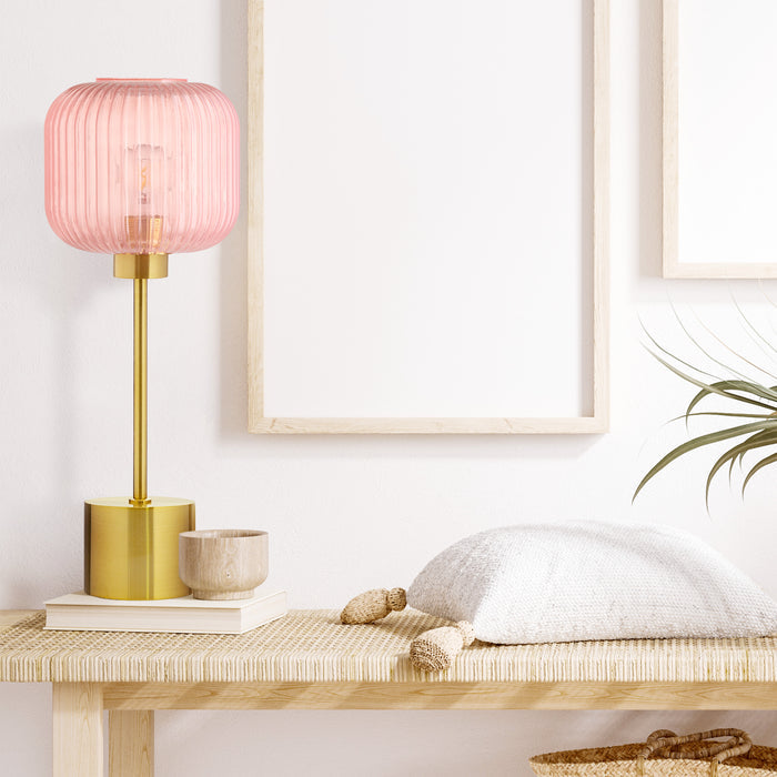21"H Eagan Globe Shade Table Lamp on a wooden table with a pillow and plant in the background