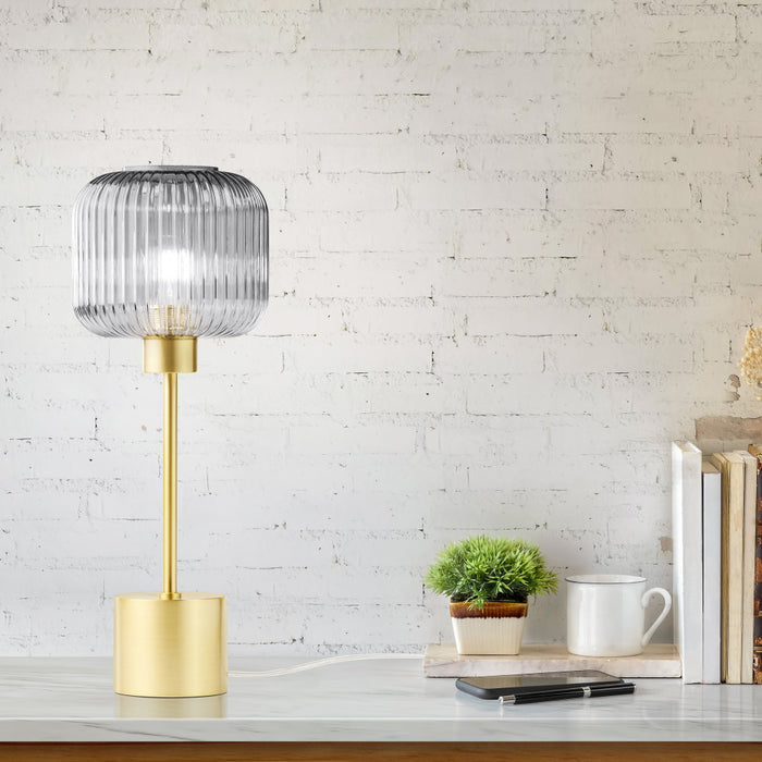 21"H Eagan Globe Shade Table Lamp on a desk with a white brick wall background.