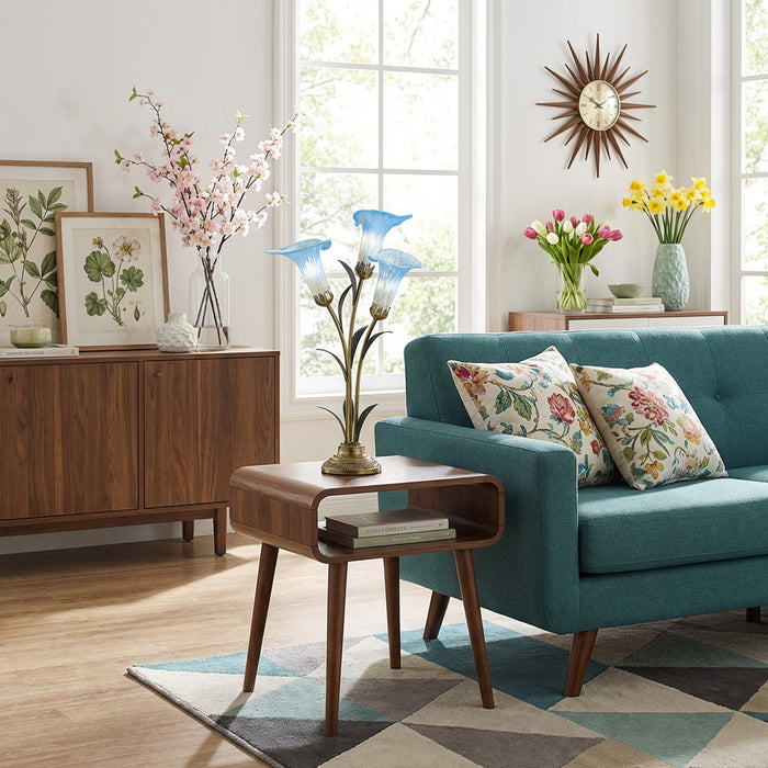 23.5"H Hand Blown Glass 3 Calla Lily Uplight Accent Lamp in a living room with teal sofa, wooden side table, and decorative elements.