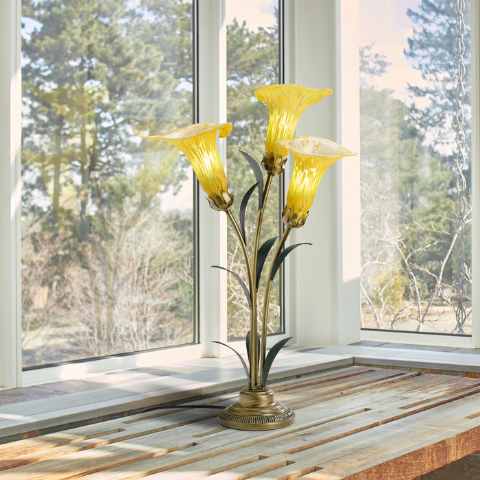 23.5"H Hand Blown Glass 3 Calla Lily Uplight Accent Lamp on a wooden surface with large windows in the background