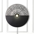 24" H Modern Black Indoor Plug In Wall Sconce on a white wall