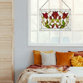 24" W Floral Vine Tiffany-Style Stained Glass Window Panel above a bed with colorful pillows.