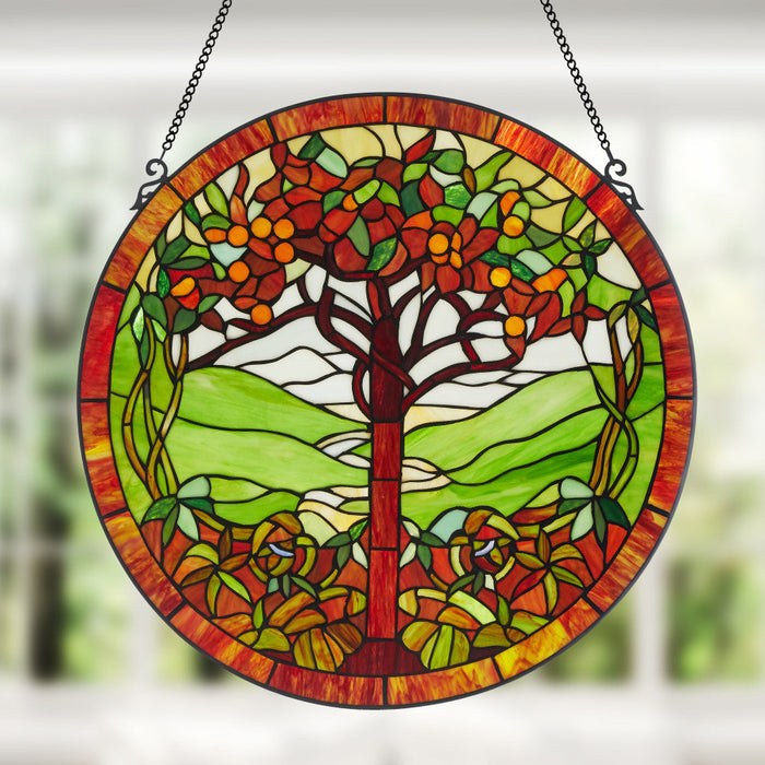 24"H Tree of Life Stained Glass Window Panel hanging in a window with a blurred background