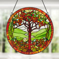 24"H Tree of Life Stained Glass Window Panel hanging in a window with a blurred background