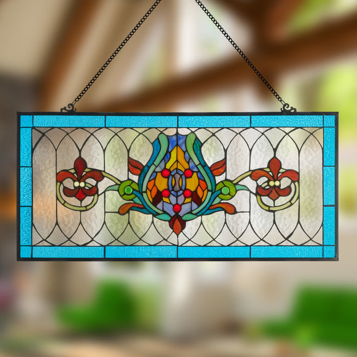 30"L Fleur De Lis Stained Glass Pub Window Panel hanging against a blurred natural background