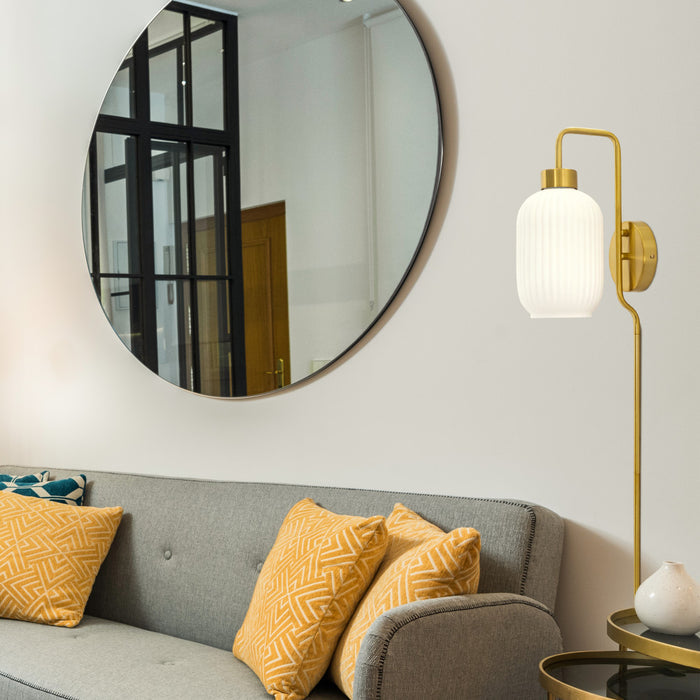 32"H Davia Retro Wall Sconce in a modern living room with gray sofa, yellow pillows, and round mirror