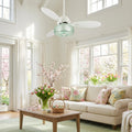 42" W Cecile LED Indoor White Ceiling Fan with Hand-Blown Seafoam Green Glass Shade with Remote Control in a living room with a beige sofa, wooden coffee table, and floral decorations.
