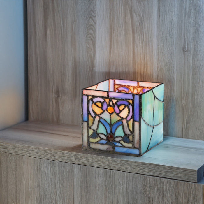 4.75" H Blue Flourishes Stained Glass Candle Holder on a wooden shelf
