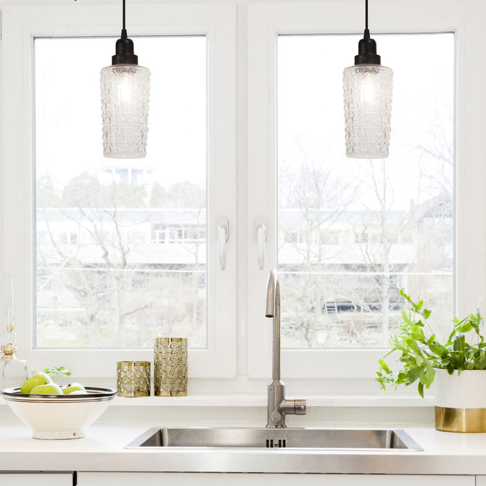 4.75" W 1-Light Haute Glass and Metal Pendant in a modern kitchen with sink, and window view