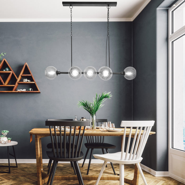 48" L 8-Light Degas Black Metal and Smoked Glass Chandelier in a dining room with a wooden table, and chairs.