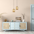 5" Maxine Brushed Gold Metal Pendant Light with Wood Shade above a light blue sideboard with decorative items in a room with beige wall.