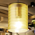 5" W Elowen Mid-Century Modern Amber Cylinder Hand Blown Glass Shade Pendant Light hanging in a blurred indoor setting